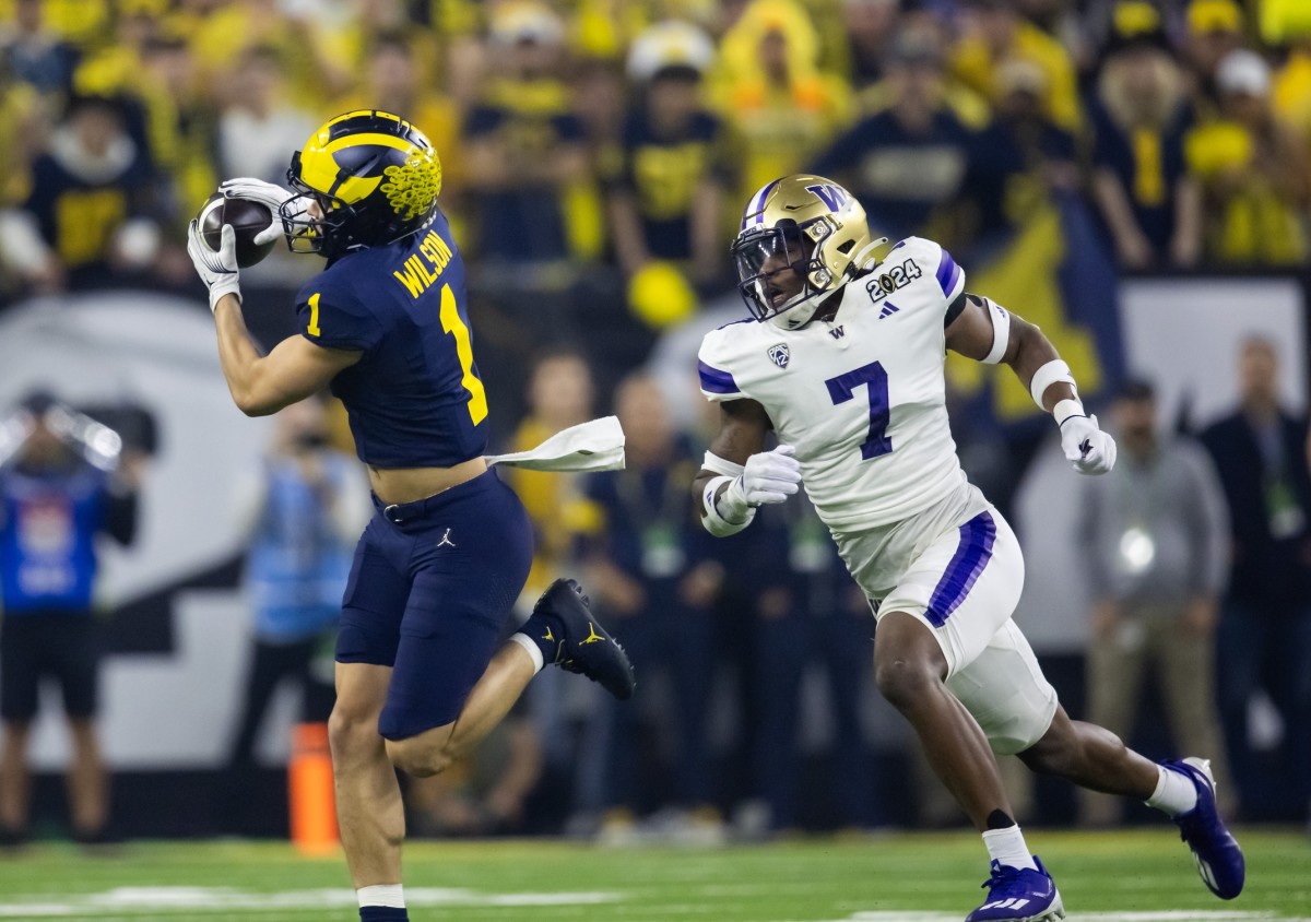 Jan 8, 2024; Houston, TX, USA; Michigan Wolverines wide receiver Roman Wilson (1) against Washington Huskies defensive back Dominique Hampton (7) during the 2024 College Football Playoff national championship game at NRG Stadium. Mandatory Credit: Mark J. Rebilas-USA TODAY Sports  